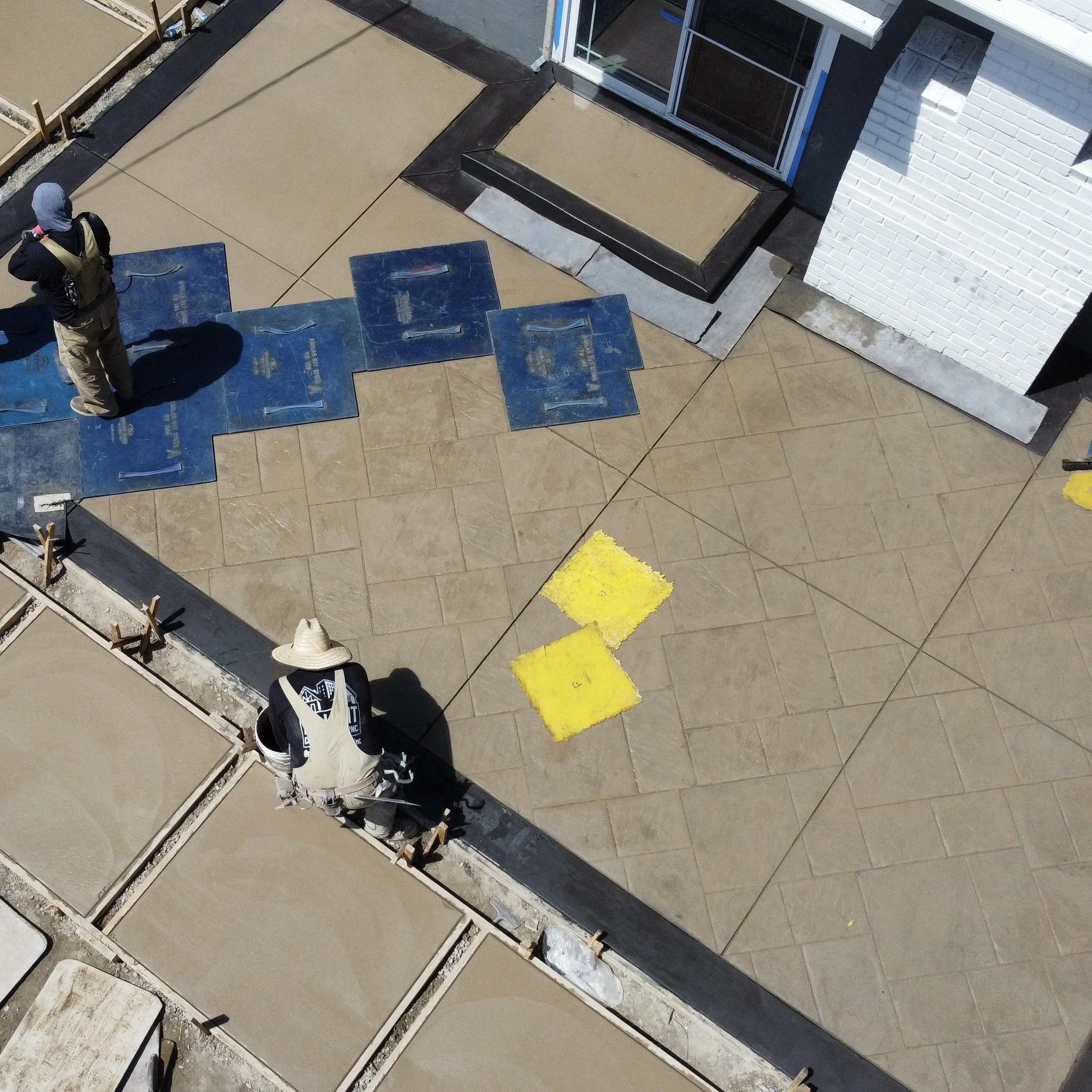 Aerial view of a completed hardscape and landscape project by No Limit Construction.